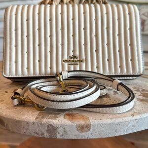 Coach ivory leather Crossbody with gold in laid pebbles.
